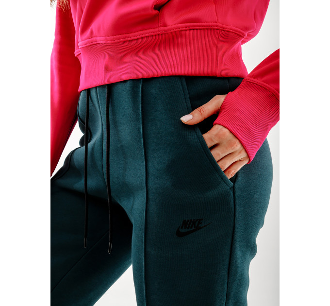 Жіночі Штани Nike NS TCH FLC MR JGGR Зелений L (7dFB8330-328 L)