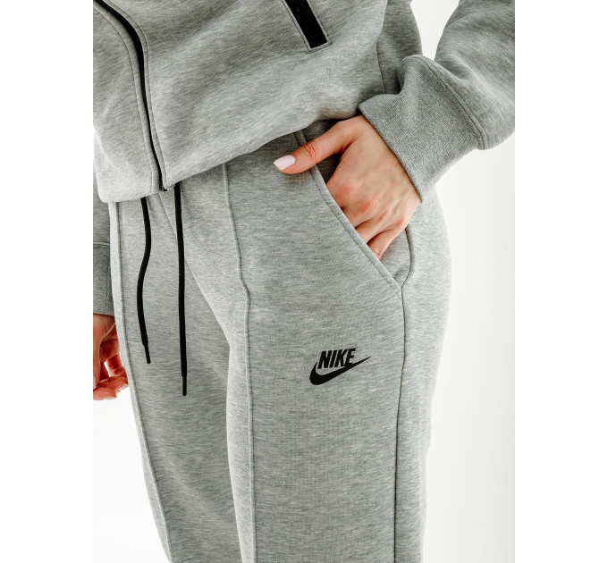 Жіночі Штани Nike NS TCH FLC MR JGGR Сірий XS (7dFB8330-063 XS)