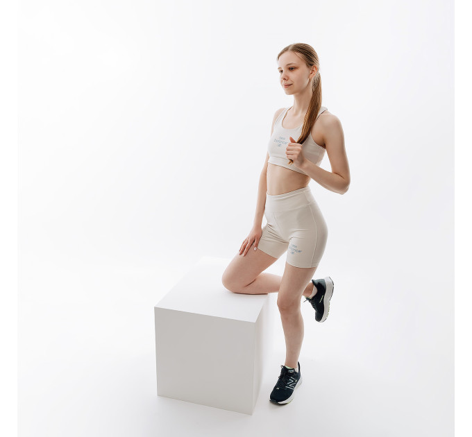 Жіночий Топ New Balance Essentials Reimagined Bra Бежевий M (7dWB31500MBM M)